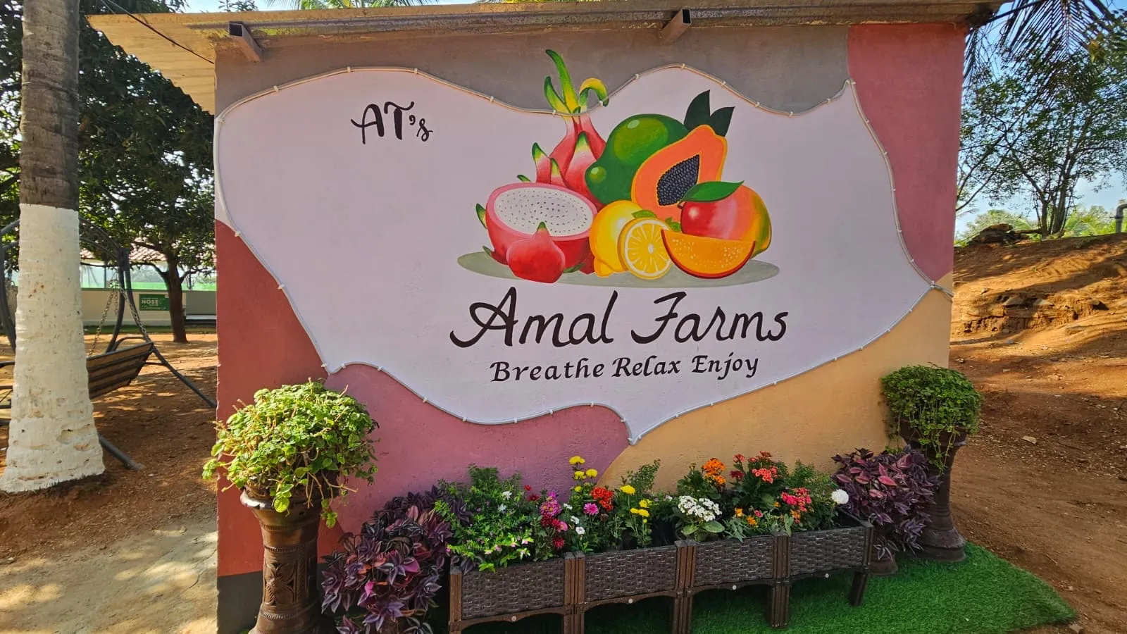 Amal Farms entrance signboard - Breathe Relax Enjoy